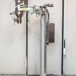 Fixed Column with Orbital Arm for Vacuum Transfer System