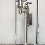 Fixed Column with Orbital Arm for Vacuum Transfer System