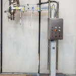Fixed Column with Orbital Arm for Vacuum Transfer System