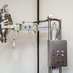 Fixed Column with Orbital Arm for Vacuum Transfer System