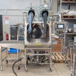 Front View of Bag Dump Station with Glove Box and External Roller Table