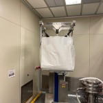Big Bag Filled with Powder Attached to Mobile Lifting Column