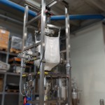 Big Bag Discharger with Hoist, Side Massagers, and Vibration Pads - Side View