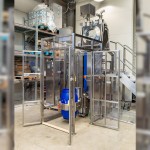 Drum Lifting and Tipping Mechanism with Protective Barriers (doors open)