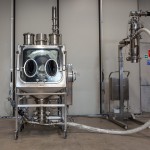 Coated Drum Emptying Glove Box System for Corrosive Powders (back view)