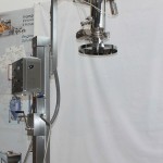 Mobile lifting column for vacuum conveyor